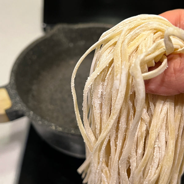 adding the okinawa soba noodles to boiling water